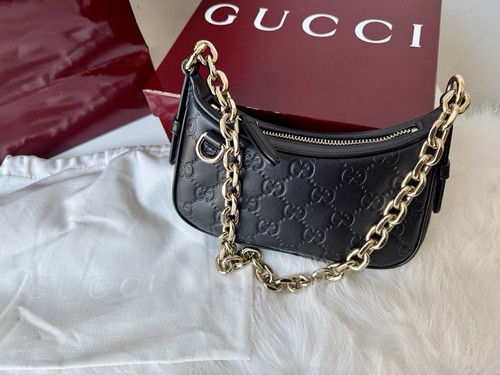 Gucci black emblem leather - emblem,